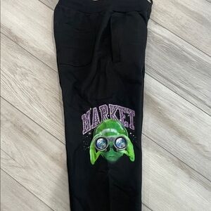 Market men’s joggers with alien face never been worn